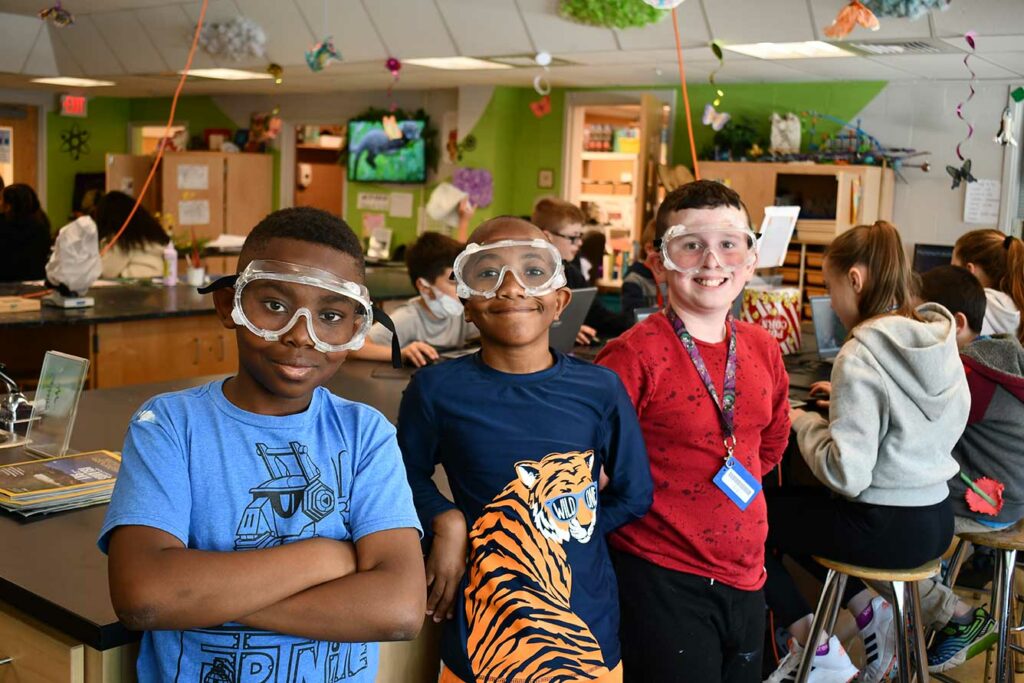 kids in the classroom with safety goggles